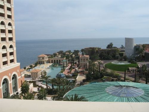 An aerial view of a resort with the ocean in the background