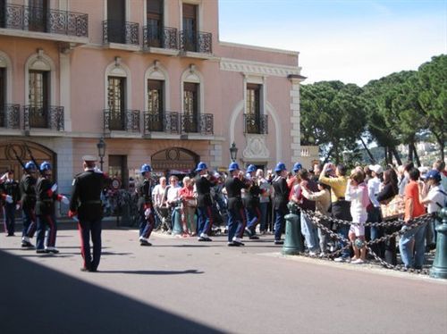 A group of people are dancing in front of a building