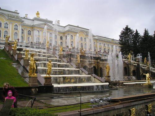A large building with a fountain in front of it