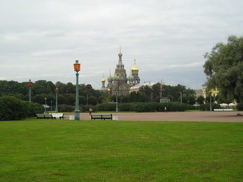 A park with a large building in the background