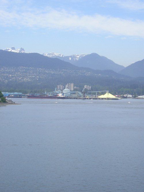 A large body of water with mountains in the background