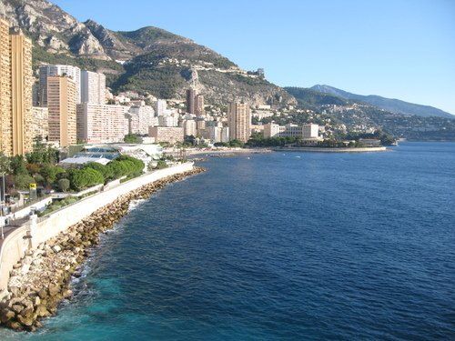 A large body of water with a city in the background