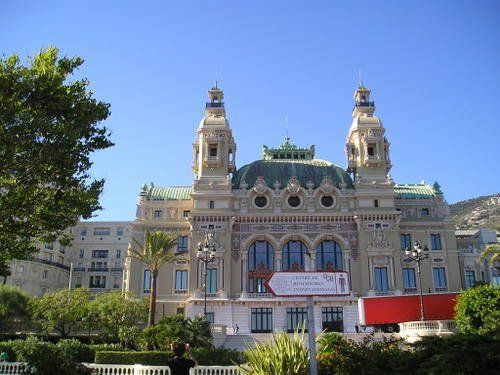 A large building with a red sign in front of it