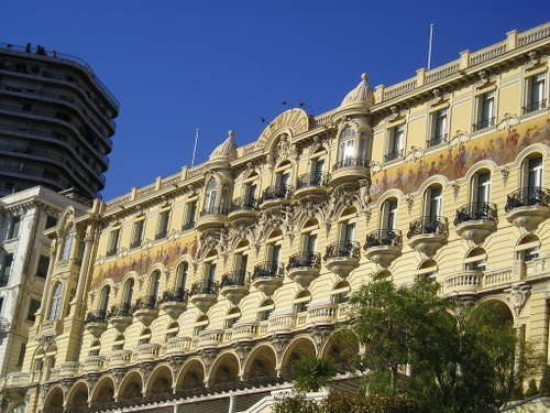 A large building with a blue sky in the background