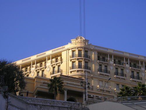 A large building with a blue sky in the background