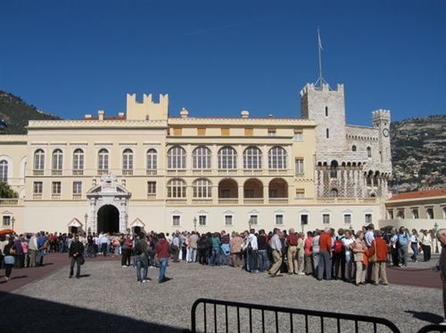 A large building with a lot of people in front of it