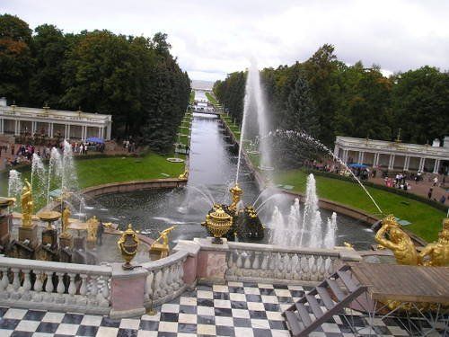 A fountain in a park with a checkered floor