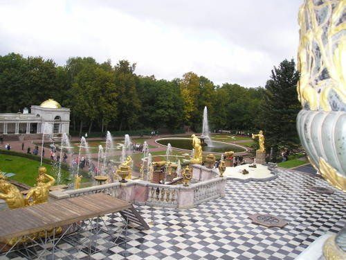 A fountain in a park with a checkered floor
