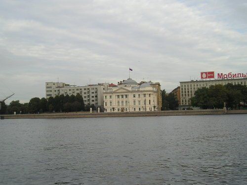A large body of water with a large building in the background
