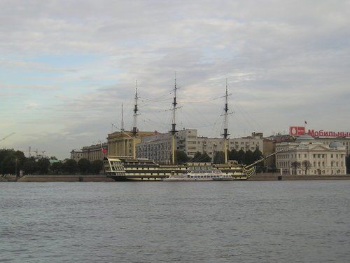 A large ship is in the middle of a body of water