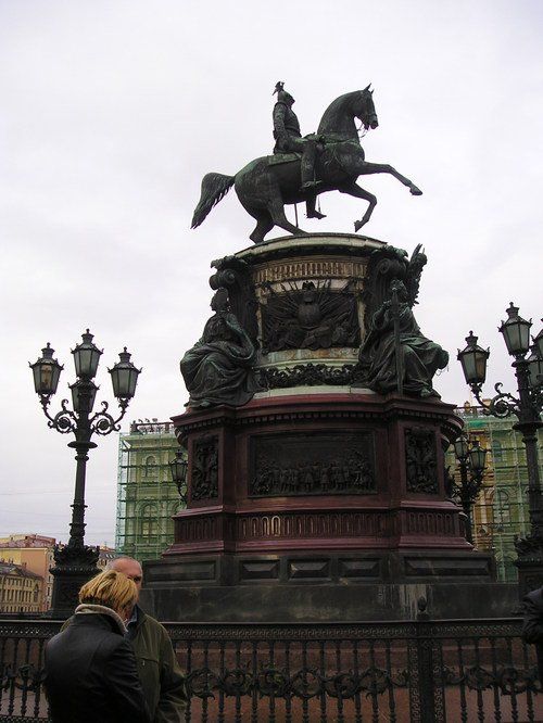 A statue of a man riding on the back of a horse