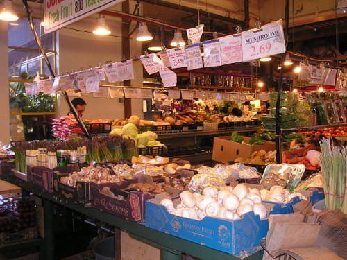 A variety of fruits and vegetables are for sale at a market