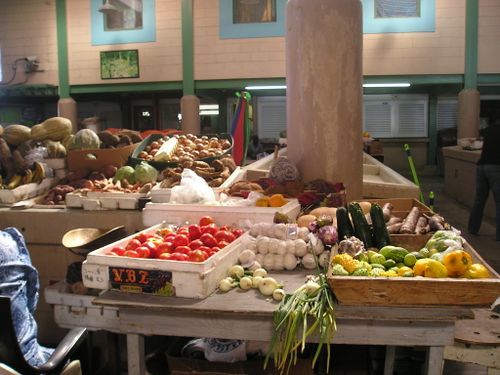 A variety of fruits and vegetables are on display at a market