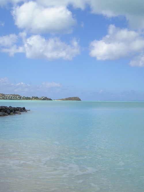A large body of water with a small island in the distance