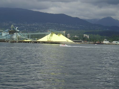 A boat in the water with mountains in the background