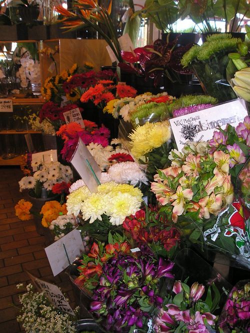 A bunch of flowers are on display in a store