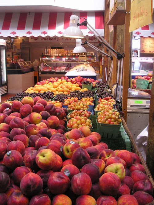 A bunch of peaches are on display at a market