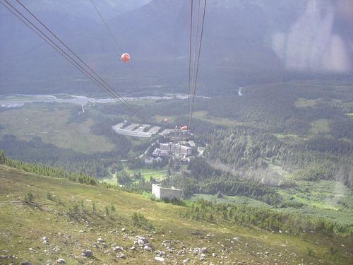 A view of a valley from a cable car.