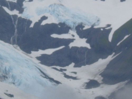 An aerial view of a snowy mountain covered in snow