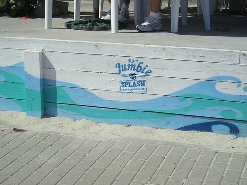 A sign on a wall that says jumbo splash
