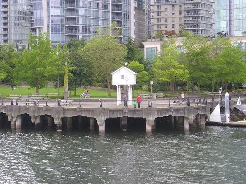 A dock with a small white house on top of it