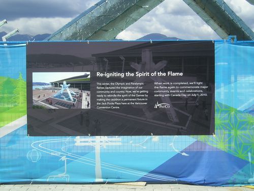 A sign that says reigniting the spirit of the flame on it