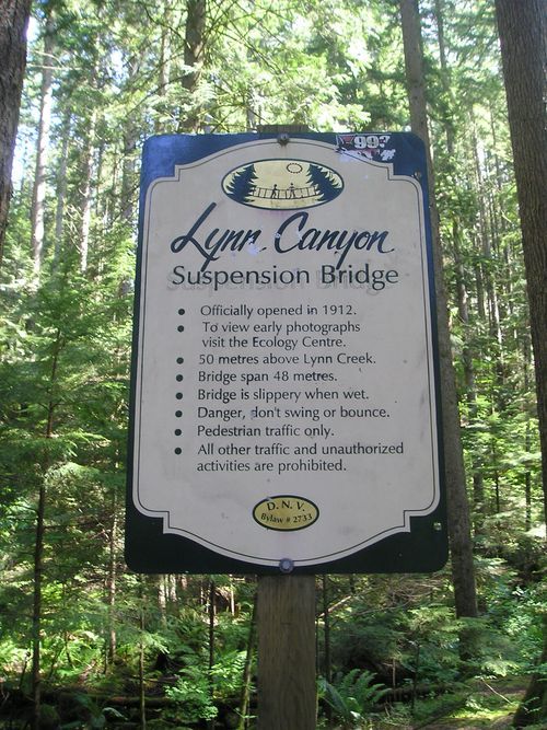 A sign for the lynx canyon suspension bridge in the woods