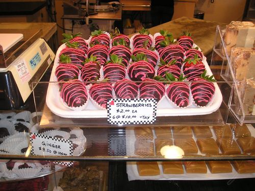 A display of chocolate covered strawberries in a store