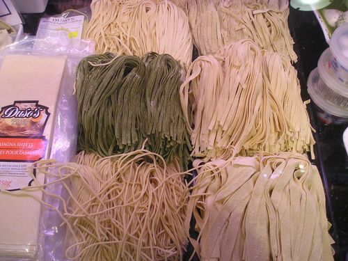 A bunch of different types of noodles are on a table