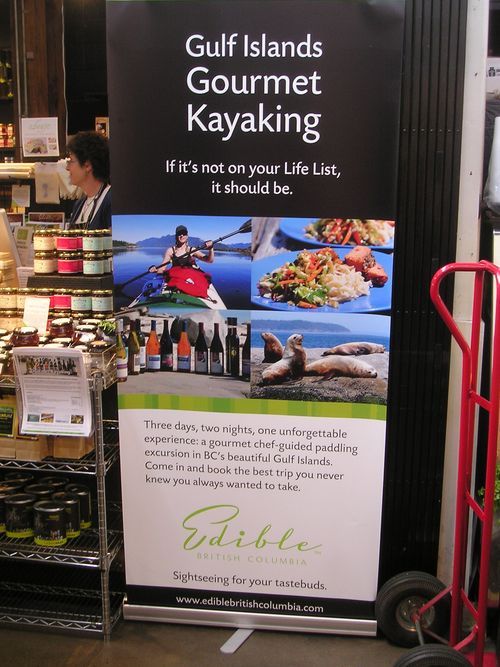 A sign that says gulf islands gourmet kayaking on it