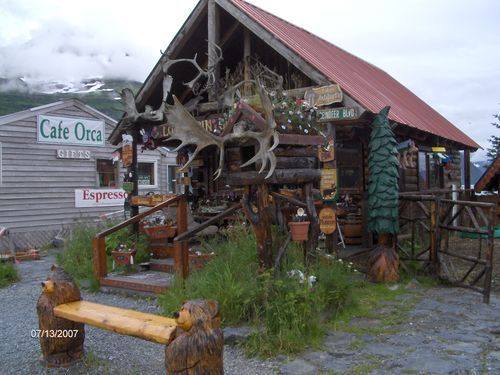 A building with a sign that says cafe orca on it