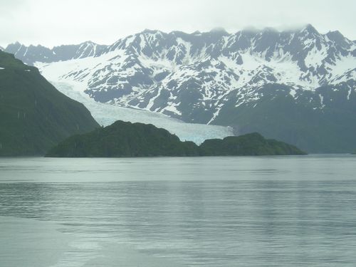 A large body of water with mountains in the background