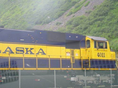 A yellow and blue train with alaska written on it