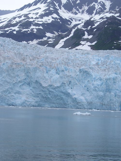 A large body of water with mountains in the background