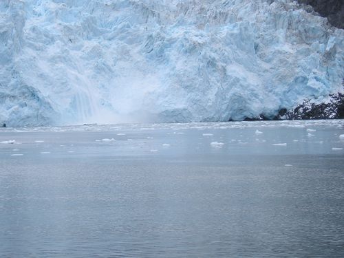 There is a large iceberg in the middle of the ocean.