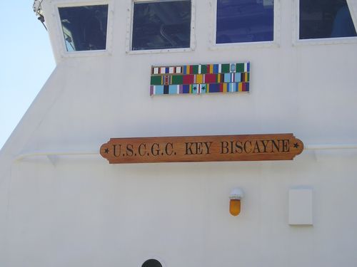 A white building with a sign that says u.s.c.g.c. key biscayne