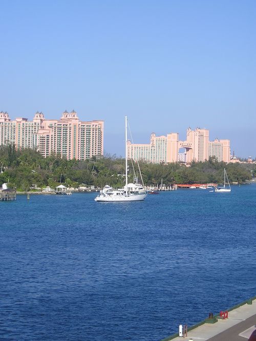 A large body of water with buildings in the background