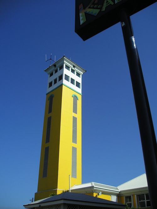 A yellow building with a sign that says ' ka ' on it