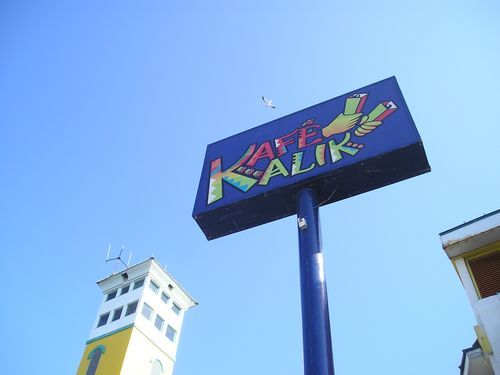 A large blue sign that says kalik on it
