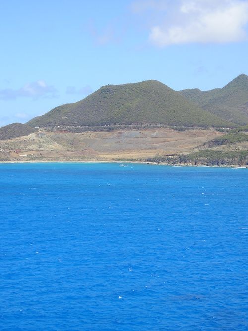 A large body of water with mountains in the background