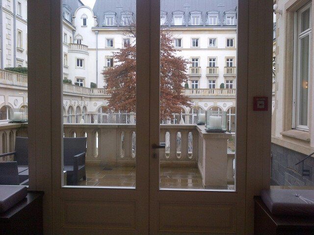 A balcony with a fire extinguisher on the wall