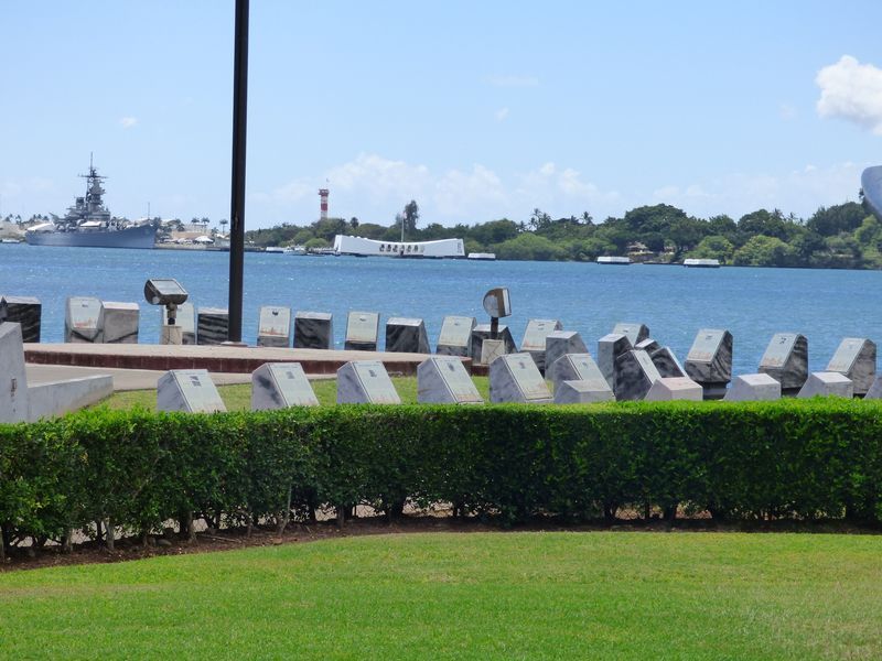 A cemetery with a large body of water in the background