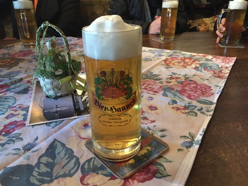 A glass of beer with the word banner on it