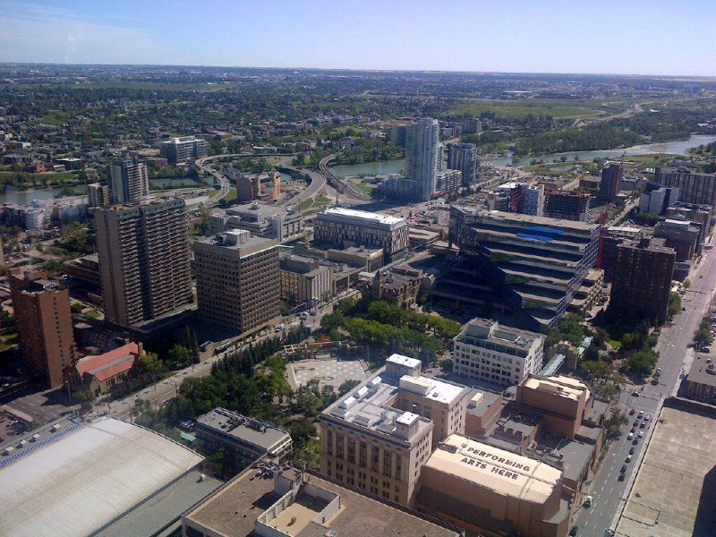 An aerial view of a city with lots of buildings and trees