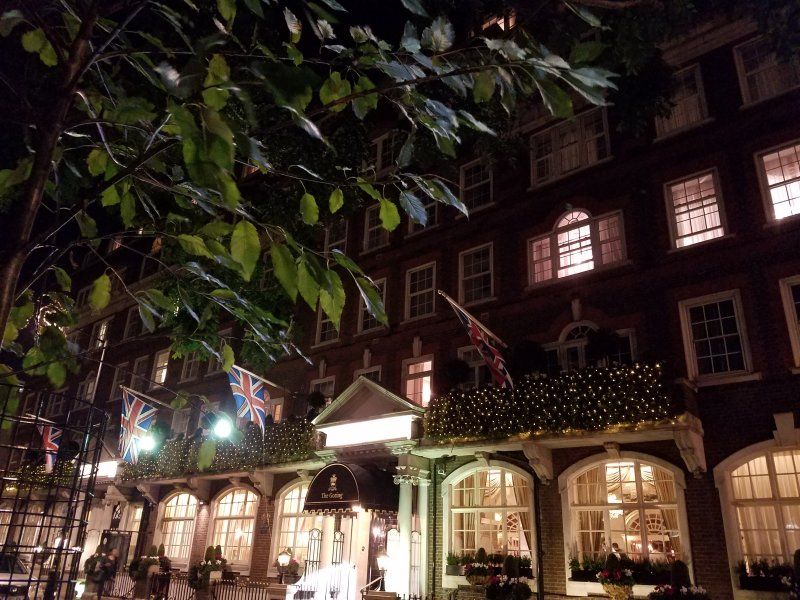 A large brick building is lit up at night