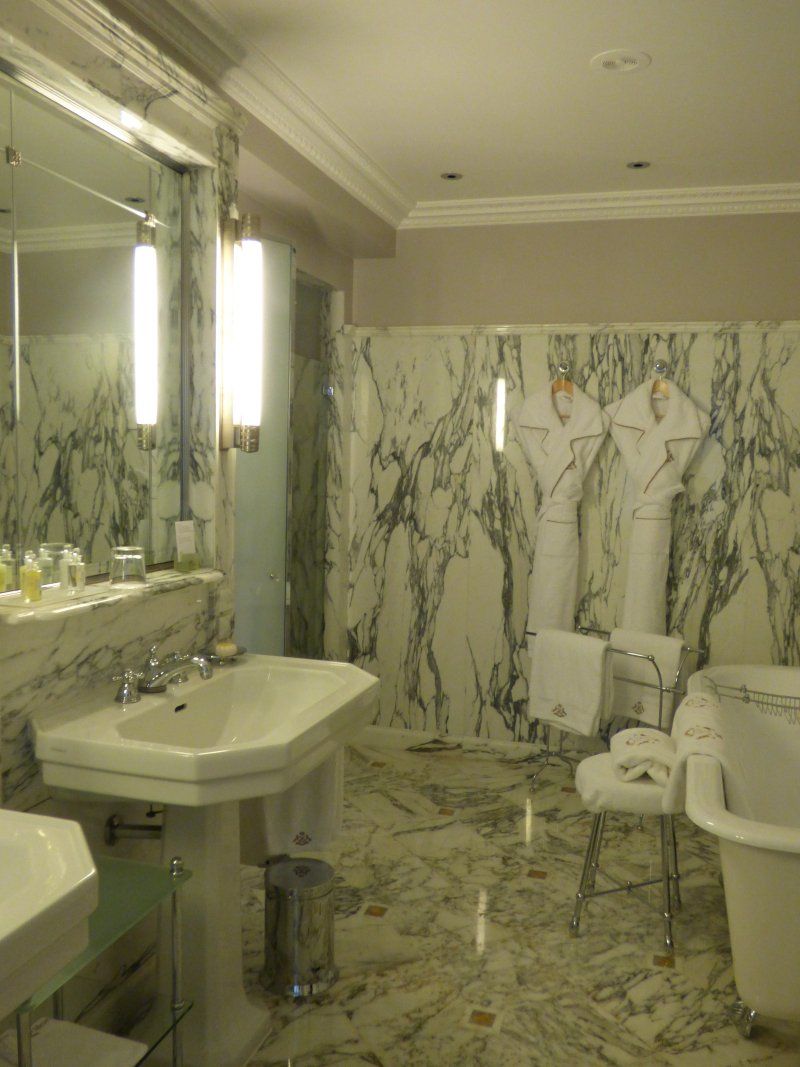 A bathroom with a sink , toilet and bathtub