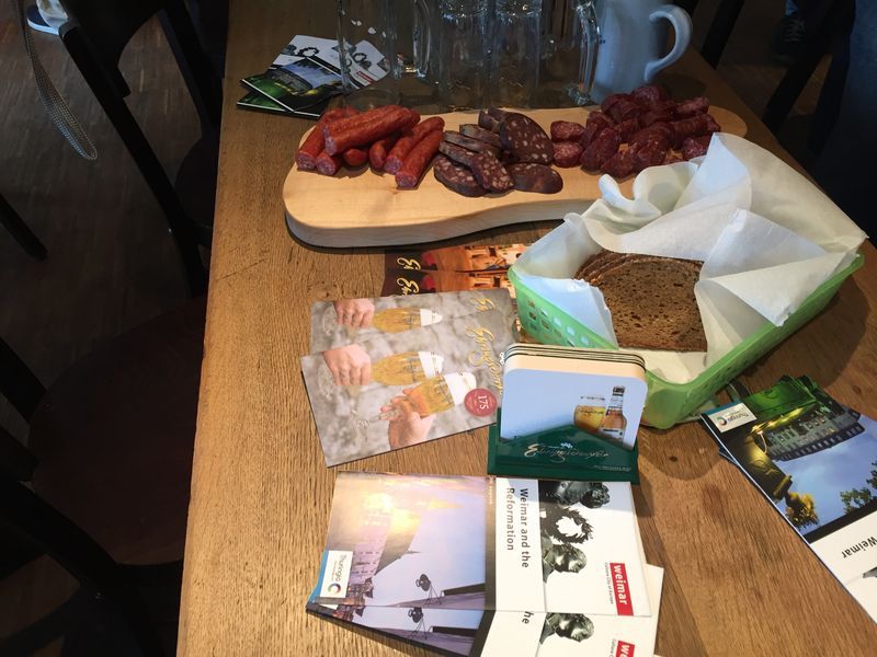 A wooden table with a variety of food on it