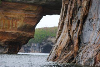 A large rock formation overlooking a body of water.