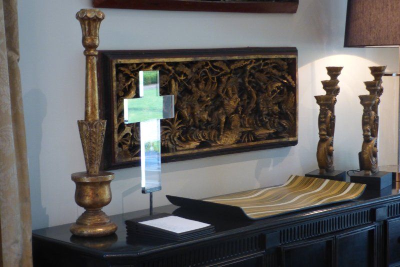 A table with candles and a picture on it