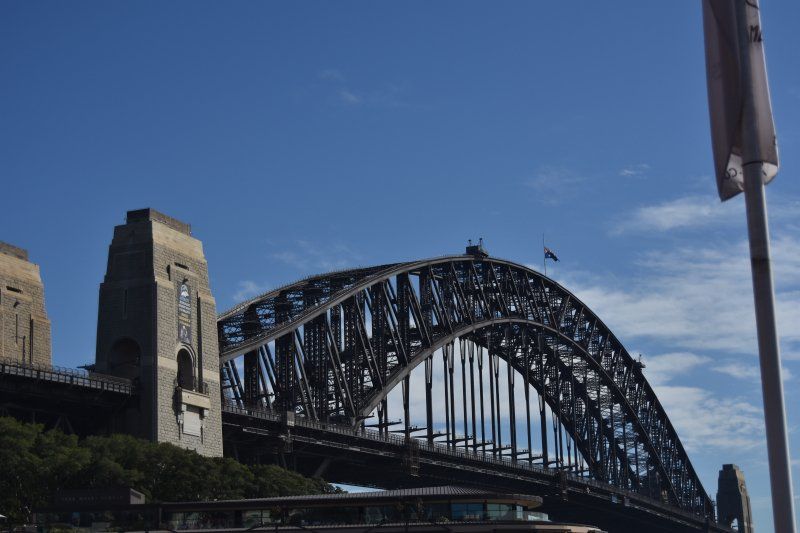 A large bridge with a blue sky in the background